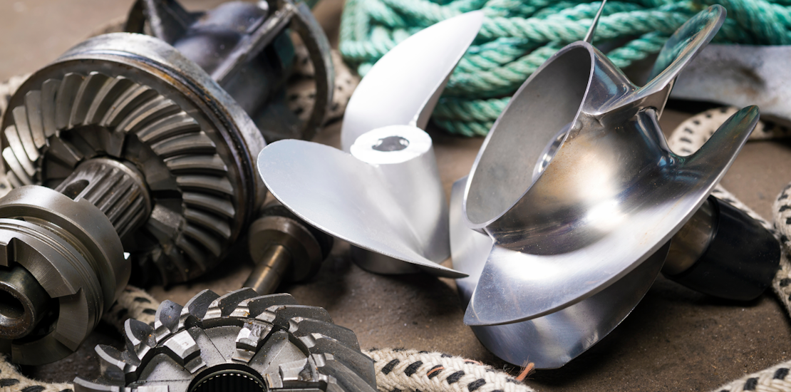 Close-up of two boat propellers, gears and ropes on the floor