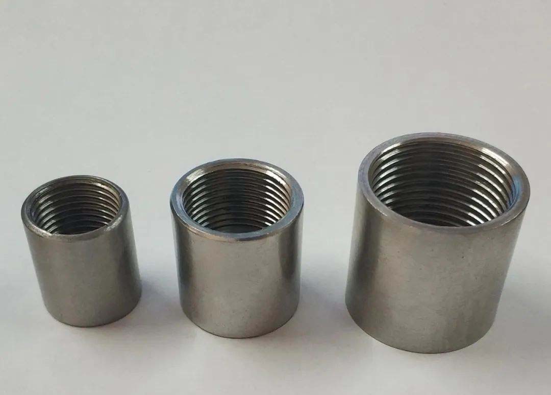 Actual photo of internal threaded pipe coupling, with internal threads at both ends, used for end-to-end pipe connection to achieve extension or same-diameter butt joint. 