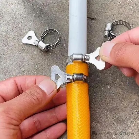 Actual photo of spring-type hose clamp, with a built-in spring for automatic compensation, adaptable to thermal expansion and contraction, commonly used for connecting engine fuel hoses.